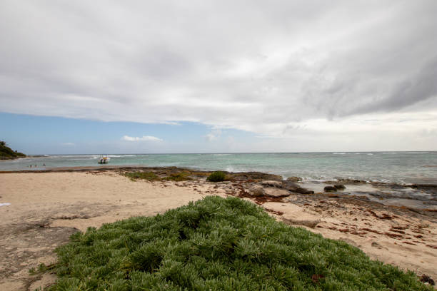 istock Caribbean bay with rocks, sandy beach and coral reef. 1094455674