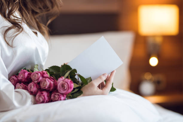 istock Young woman with flowers 1094456360