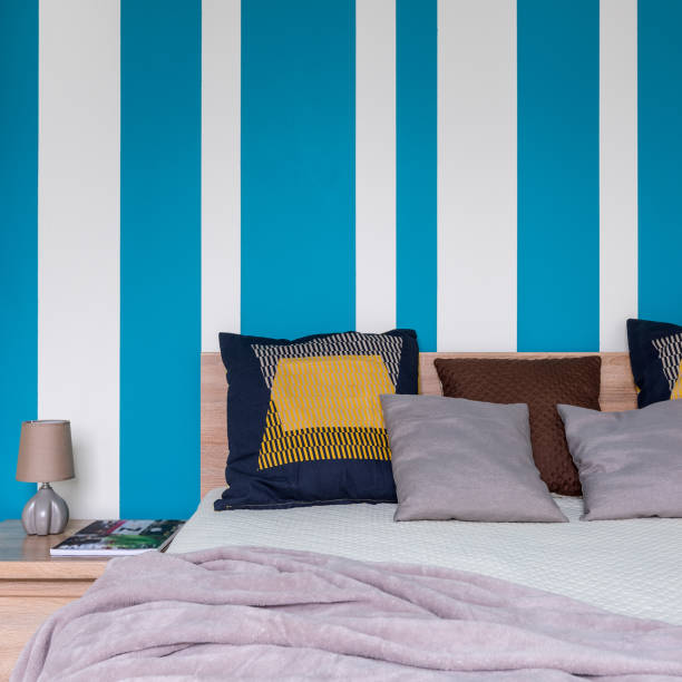 istock Bedroom with stripes on wall 1094457870