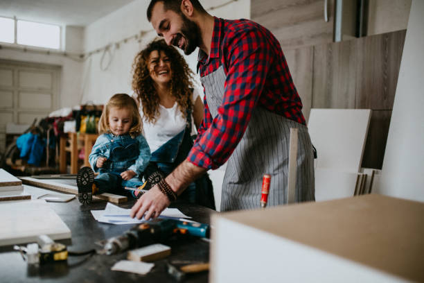 istock Young family is working in the joinery 1094457930