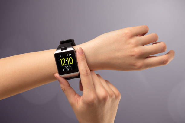 istock Female hand wearing and pressing smartwatch 1094457964