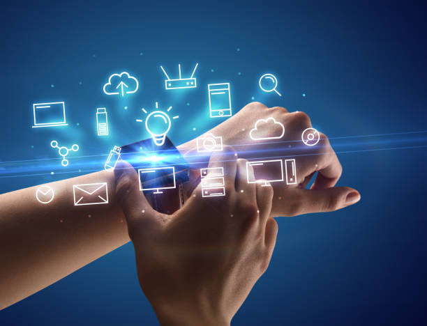 istock Hand wearing smartwatch with multimedia symbols 1094458276