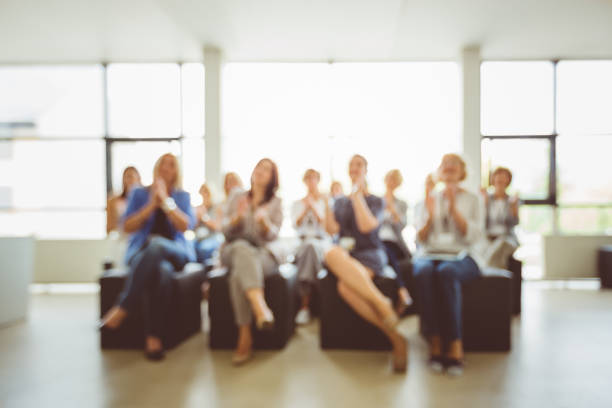 istock Group of women applauding during seminar 1094458554