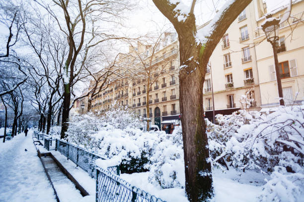 istock Snow-covered streets of Paris after snowfall 1094461772