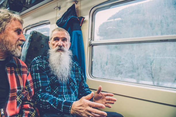 istock Senior Friends with Beards Traveling by Train 1094469048