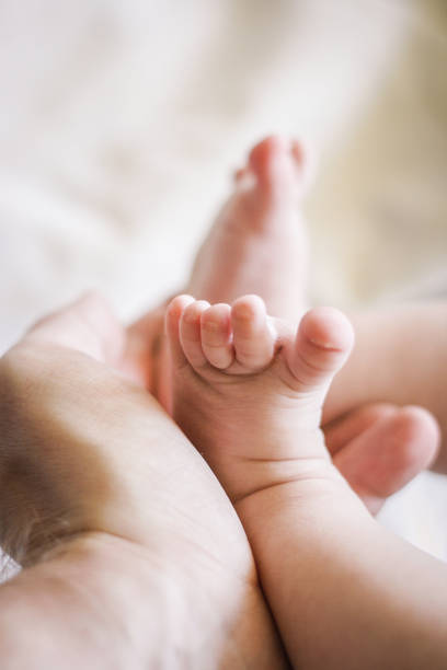 istock A father's hand are holding baby feet 1094469272
