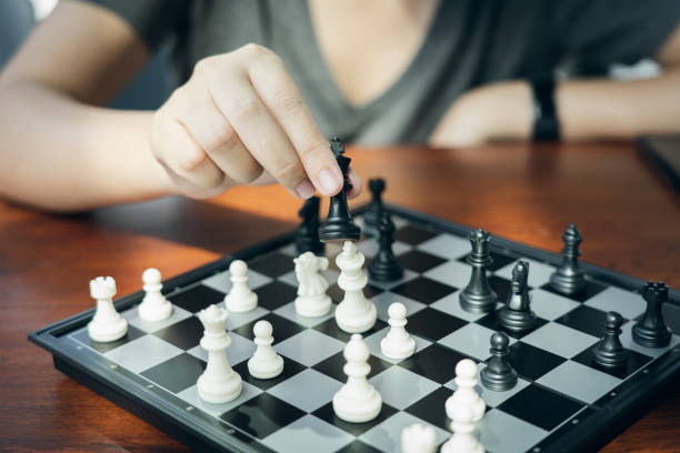 istock Businessman holding a King Chess is placed on a chessboard.using as background business concept and Strategy concept with copy space for your text or design. 1094469458