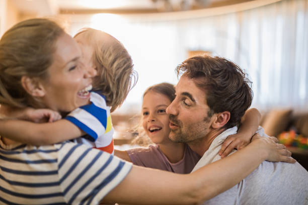 istock Young joyful family embracing at home. 1094470222