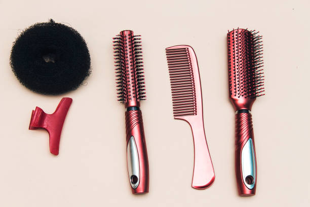 istock Professional hairdressing tools isolated on red, pink background 1094470496