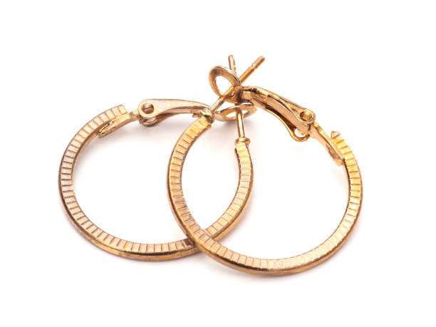 vintage gold colour hoop earrings, pair, on white background. - earring imagens e fotografias de stock