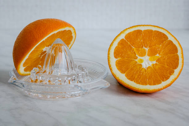 istock Orange and a citrus juicer 1094478792