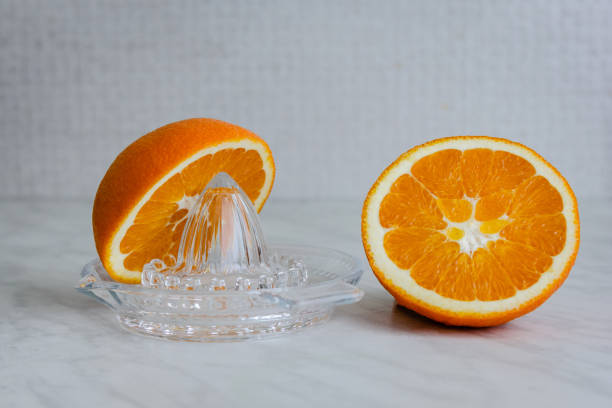 istock Orange and a citrus juicer 1094478796