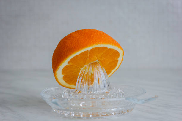 istock Orange and a citrus juicer 1094478798