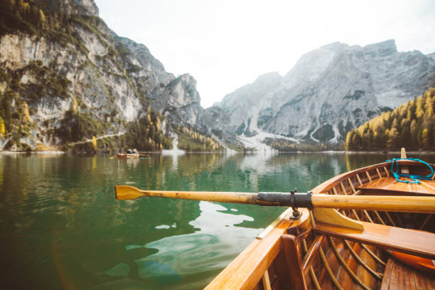 istock Traditional rowing boat on a lake in the Alps in fall 1094480554