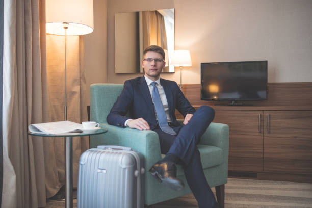 istock Young businessman in a suit in room 1094488086