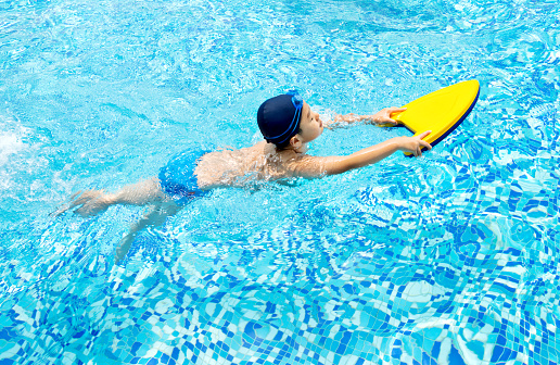 Little boy in swimming training