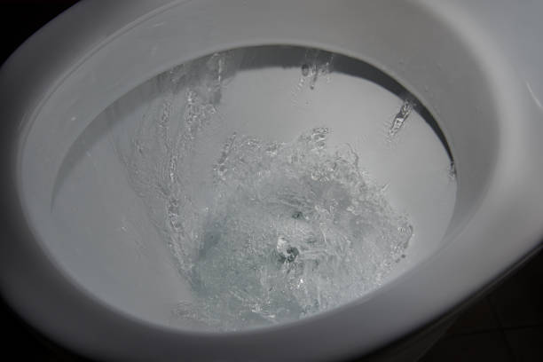 istock Water flushing in toilet. 1094492224