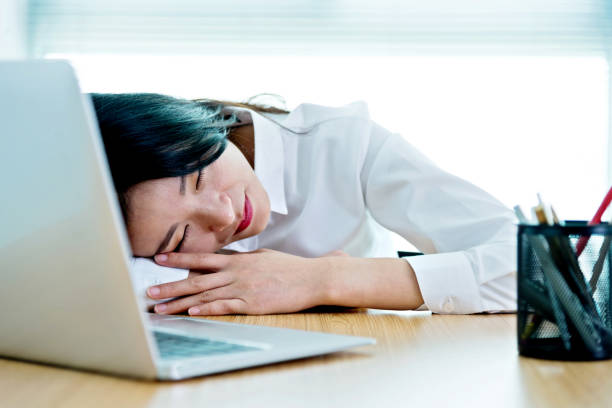 istock Businesswoman napping on desk 1094496042