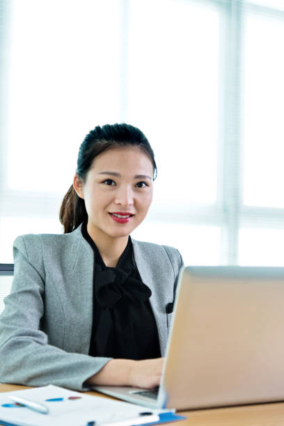 istock Beautiful businesswoman using laptop 1094496196