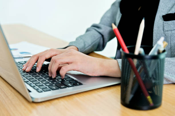 istock Woman hands on laptop keyboard 1094496252