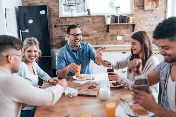 istock Roommates eating pancakes for breakfast and having fun. 1094497684