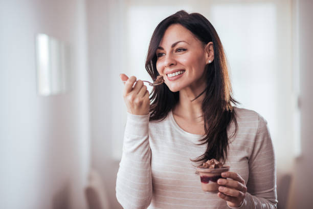 istock Beautiful woman eating dessert. 1094500308