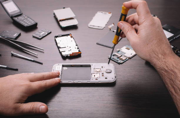 istock mobile phone repair, hands closeup 1094500746