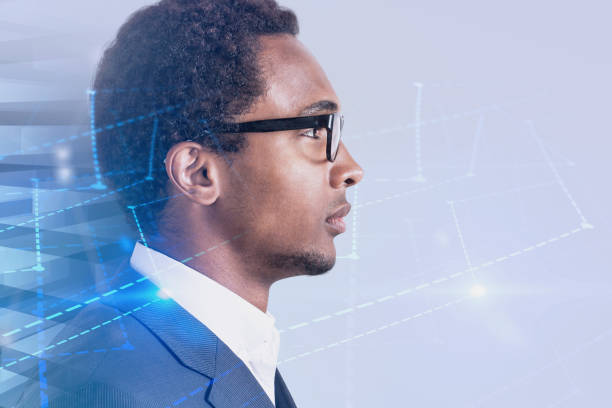 Side view of handsome serious African American businessman looking forward. Futuristic interface and graph in background. Marketing and advertising hi tech concept. Toned image double exposure mock up