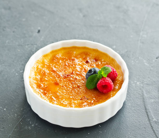 istock Creme brulee. dessert with caramel crust and berries. 1094507602