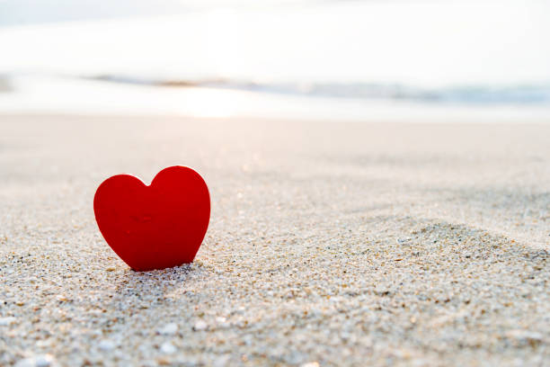 istock Red heart shape on the beach 1094509284