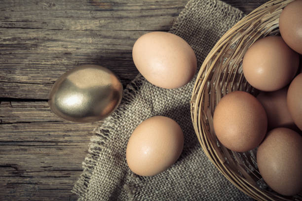 istock brown and golden chicken eggs 1094514306