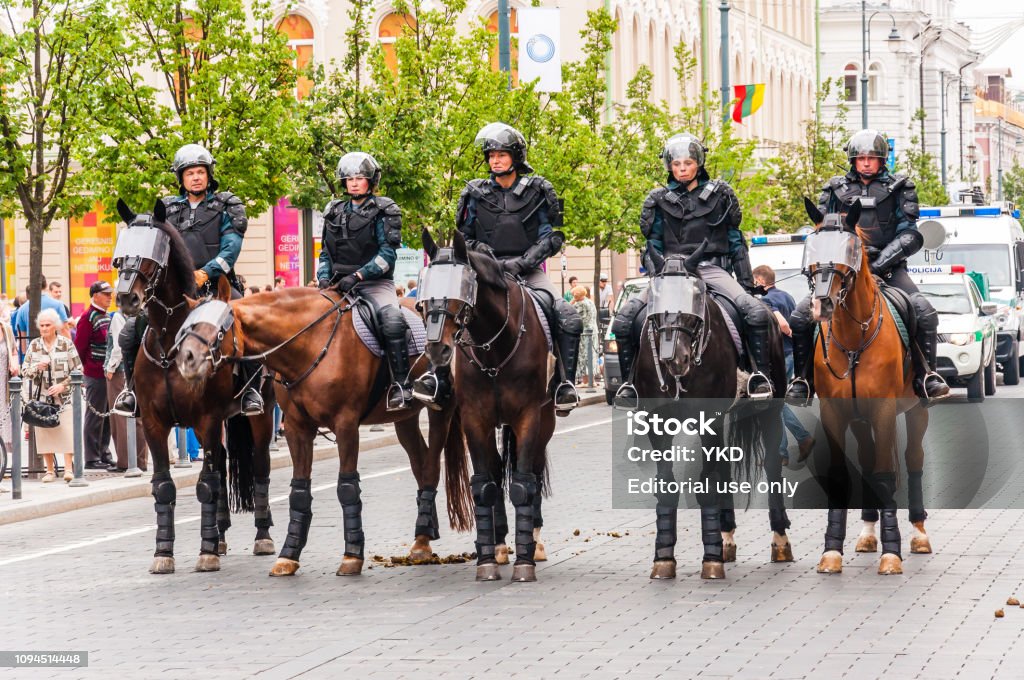 Armed mounted police forces standing at the beginning of Pride parade on Gedimino street. Event celebrating lesbian, gay, bisexual, transgender, LGBTI culture pride Vilnius, Lithuania - July 27, 2013: Armed mounted police forces standing at the beginning of Pride parade on Gedimino street. Event celebrating lesbian, gay, bisexual, transgender, LGBTI culture pride Armored Clothing Stock Photo