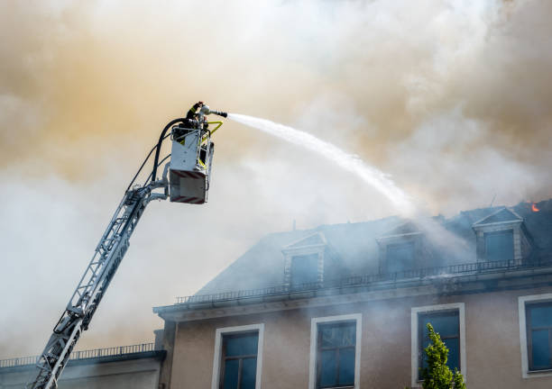 fire brigade in action - water cannon imagens e fotografias de stock