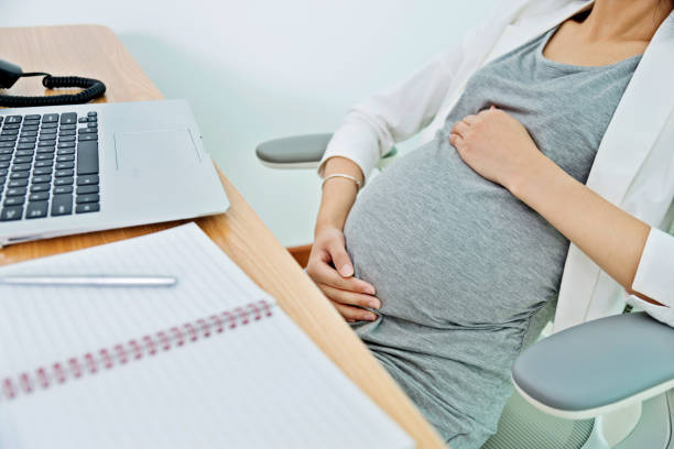 istock Pregnant woman working on laptop 1094518368