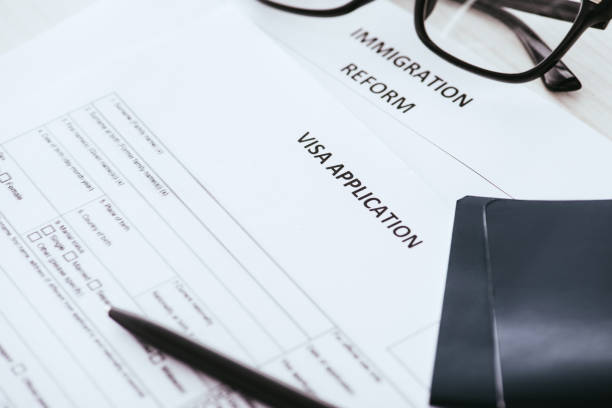 istock selective focus documents with lettering near glasses and passports 1094519352