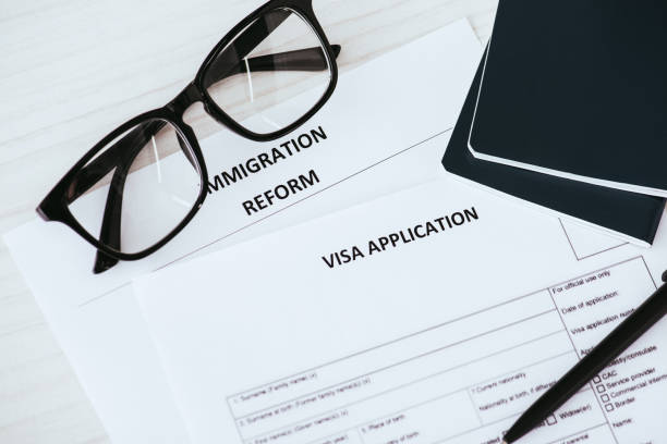 istock documents with lettering near glasses and passports 1094519362