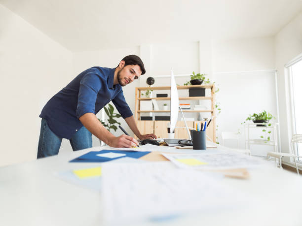 istock Latin young man busy working 1094522998