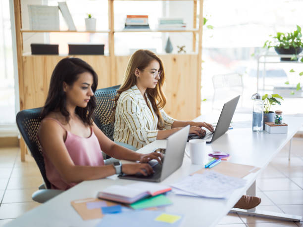 istock Young females working in laptop 1094523148