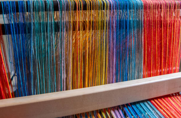 istock Colored threads of an ancient wooden loom 1094523346