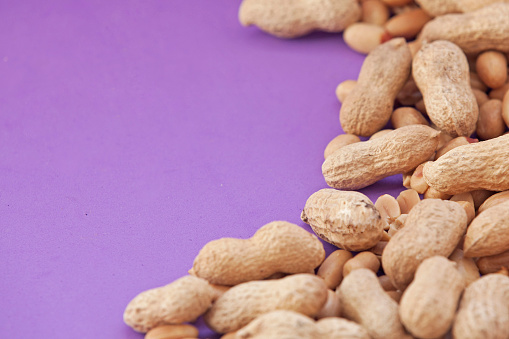 peanuts on a purple background