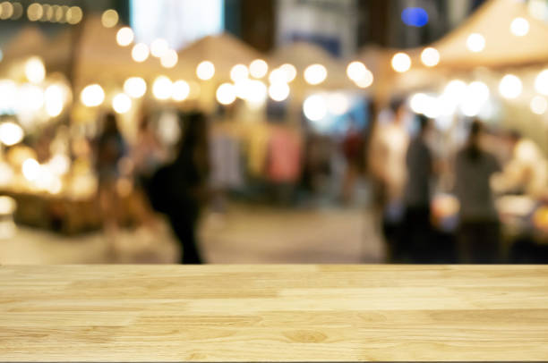 istock empty wood table with night street market background. 1094530460