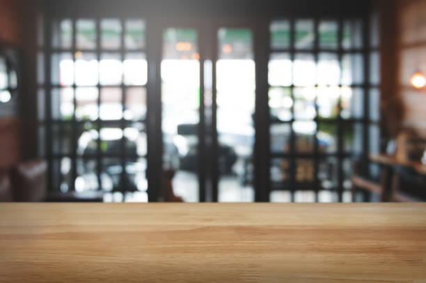 istock empty wooden plank with blurred cafe bar background. 1094530502