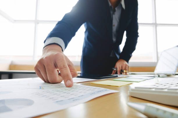 istock business man working on business documents, calculator and laptop at a workplace 1094530572