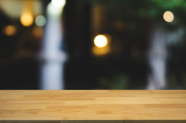 istock empty wood table with montage blurred coffee cafe background 1094530588