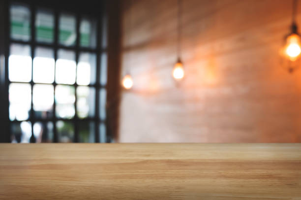 istock empty wood table with montage blurred coffee cafe background 1094530594