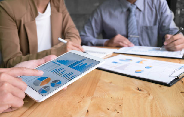 istock business executives discussing documents and ideas at meeting in a workplace 1094530716