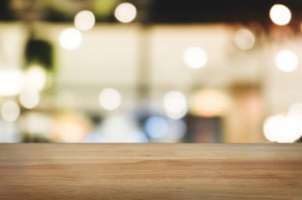 istock wooden table top in front of blur restaurant background 1094530816