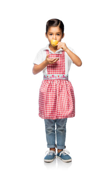 Latin little girl drinking tea and playing posing on a white background