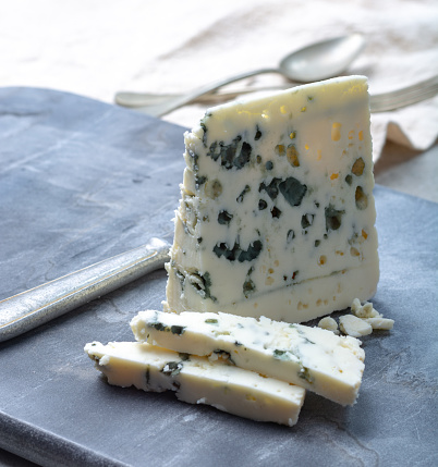 Piece of French blue cheese Roquefort, made from sheep milk in caves of Roquefort-sur-Soulzon