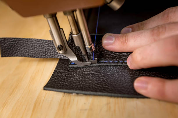 istock Closeup Adding a Leather Pocket on a Commercial Sewing Machine 1094548016